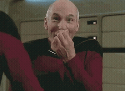 Bald Man In Red Star Trek Uniform Smiling GIF