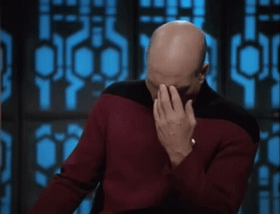 Bald Man In Red Sweater Covering Face GIF