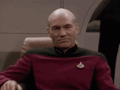 Bald Man In Red Sweater Making Face GIF