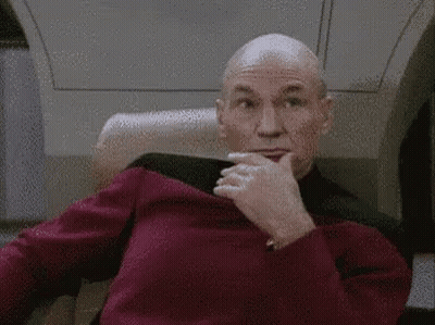 Bald Man In Red Sweater Making Face GIF
