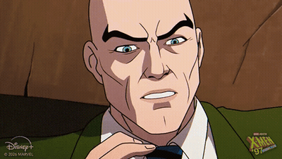 Bald Man in Red Sweater With Diamond Emblem