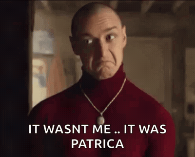 Bald Man In Red Turtleneck And Necklace Sad Face GIF