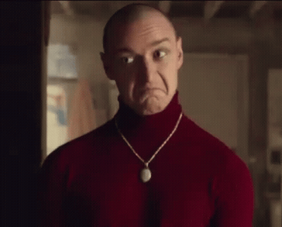 Bald Man In Red Turtleneck Making Sad Face GIF