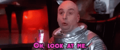 Bald Man In Space Suit Holding Lamp GIF