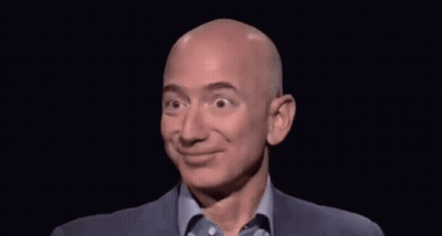 Bald Man In Suit And Blue Shirt Smiling GIF