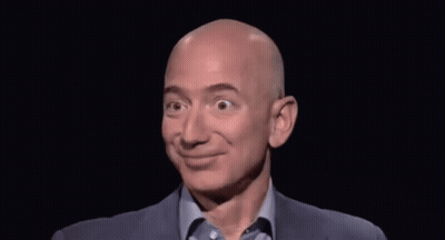 Bald Man In Suit And Blue Shirt Smiling GIF