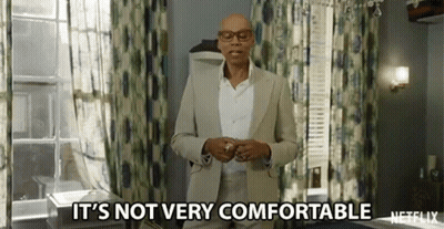 Bald Man In Suit And Glasses Saying It's Not Very Comfortable GIF