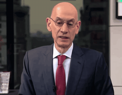 Bald Man In Suit And Tie Before Green Light GIF