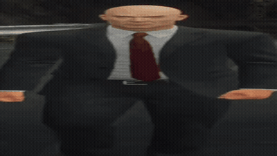 Bald Man In Suit And Tie In Dark Room GIF