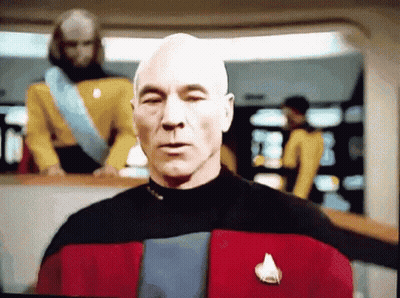 Bald Man In Suit And Tie Looking Left GIF