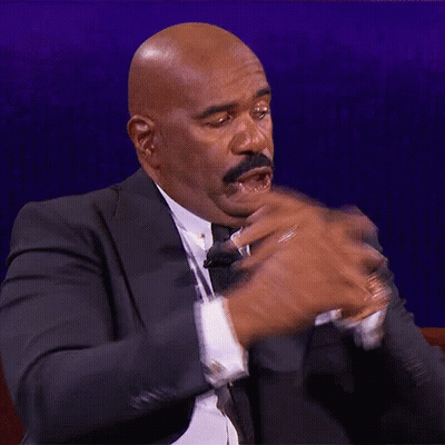 Bald Man In Suit And Tie Making Funny Face GIF