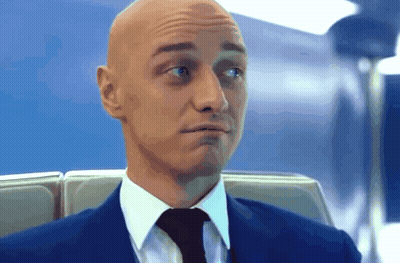 Bald Man In Suit And Tie Making Funny Face GIF