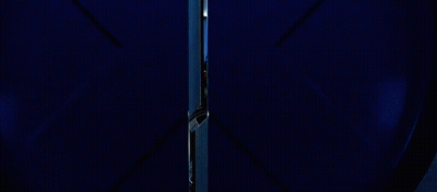 Bald Man In Suit And Tie Sitting In Chair GIF