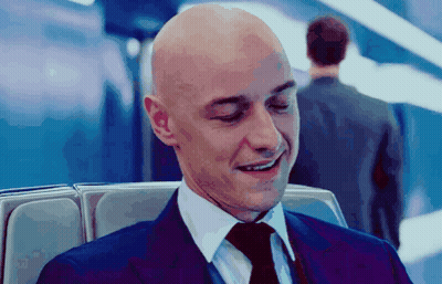 Bald Man In Suit And Tie Smiles GIF