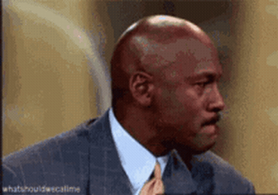 Bald Man in Suit and Tie Talking