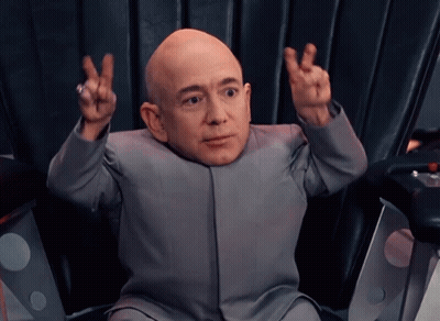 Bald Man in Suit Giving Peace Sign