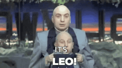 Bald Man In Suit Holding Smaller Man's Head GIF