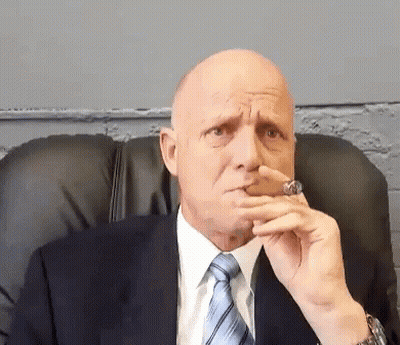Bald Man In Suit Smoking Cigar GIF