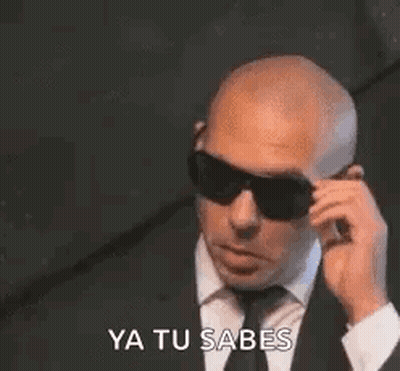 Bald Man In Suit Talking On Cell Phone GIF