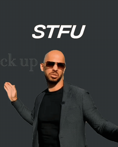 Bald Man In Sunglasses And Suit In Front Of STFU Sign GIF