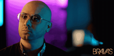 Bald Man In Sunglasses In Front Of Bravas Poster GIF