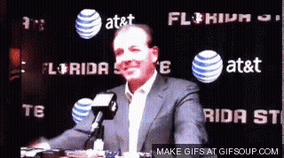 Bald Man In White Shirt And Tie Holding Hose Smiling GIF
