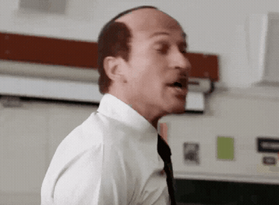 Bald Man In White Shirt And Tie Speaking GIF