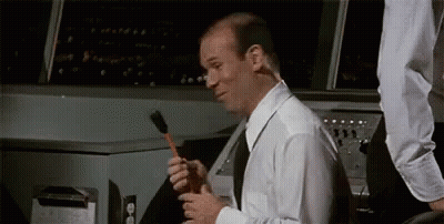 Bald Man In White Shirt Holding Brush GIF