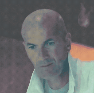 Bald Man In White Shirt Looking At Camera GIF