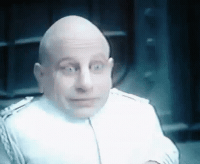 Bald Man In White Suit Making Funny Face GIF