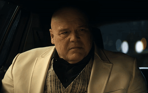 Bald Man In White Suit Sitting In Car GIF