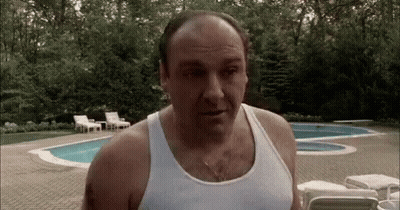 Bald Man In White Tank Top By Pool GIF