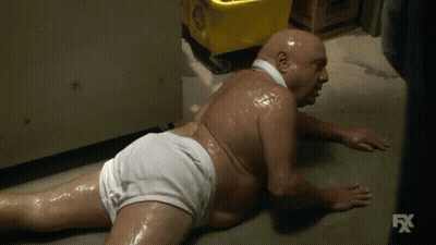 Bald Man In White Underwear Lying On Floor GIF