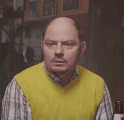 Bald Man In Yellow Vest And Plaid Shirt With Beer GIF