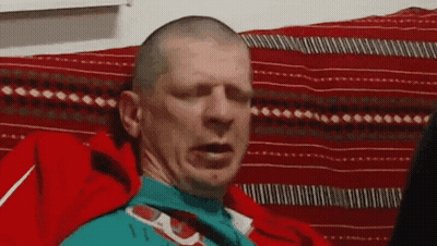 Bald Man Making Funny Face On Couch GIF