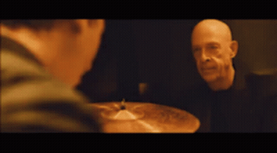 Bald Man Playing Cymbal Near Another Man GIF