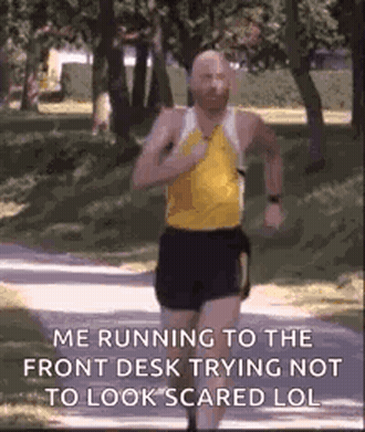 Bald Man Running To Front Desk Not Scared GIF