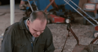 Bald Man Sitting At Diner Table GIF
