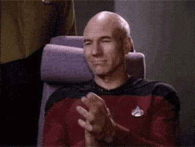 Bald Man Sitting In Chair Applauding GIF