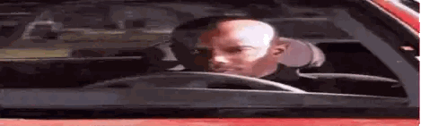 Bald Man Sitting In Red Car Sticker