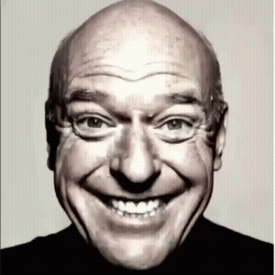 Bald Man Smiling In Black Shirt GIF