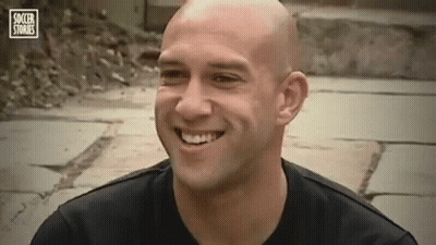 Bald Man Smiling In Black Shirt GIF