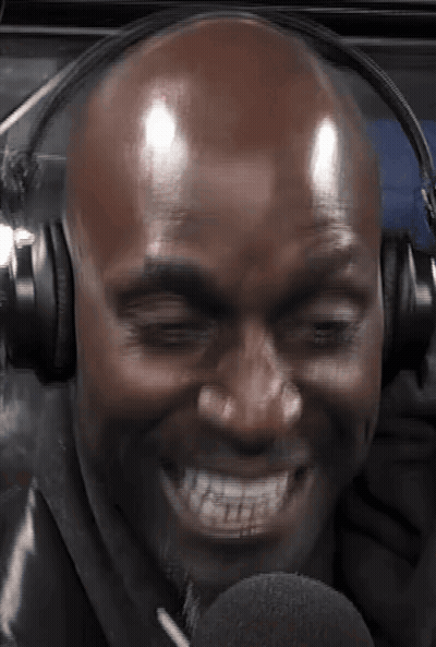 Bald Man Smiling In Headphones And Microphone GIF