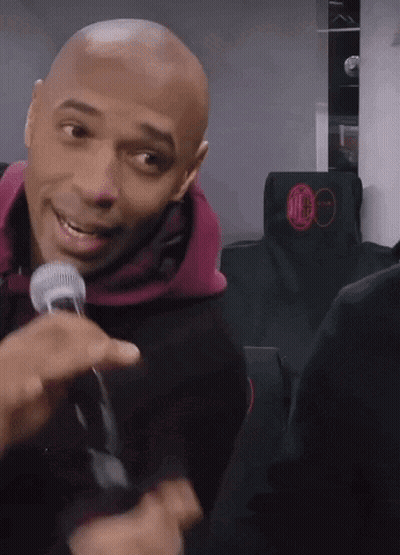Bald Man Smiling With Microphone GIF