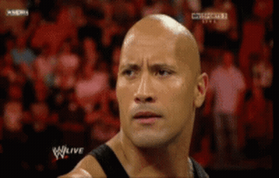 Bald Man Standing In Crowd GIF