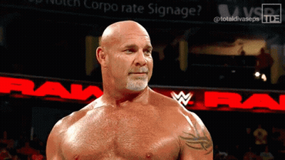 Bald Man Standing In Front Of Raw Sign GIF