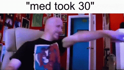 Bald Man Standing In Front Of Red Wall Med Took 30 GIF