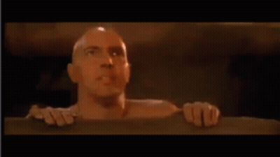 Bald Man Sticking Head Out Of Wall Hole GIF