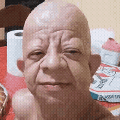 Bald Man Taking Selfie With Toilet Paper Rolls GIF