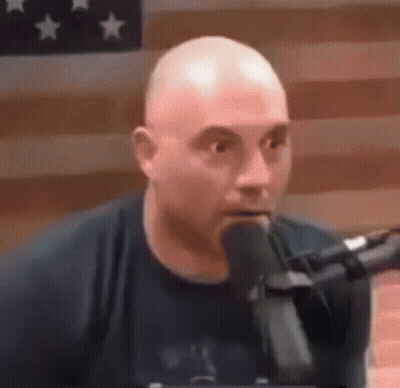 Bald Man Talking Into Microphone GIF